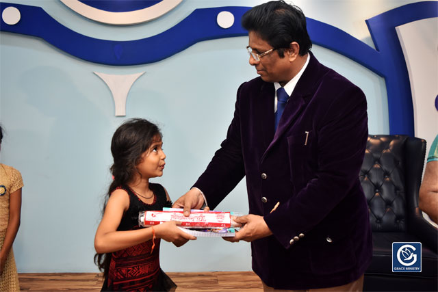 About Ten Poor and needy Students from Various Schools and Colleges of Mangalore brightened up as they received books, umbrellas and Education Scholarship from Grace Ministry on Sunday, June 16th, 2019. 